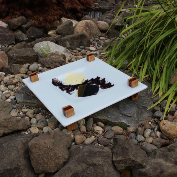 White glass tray with wood legs